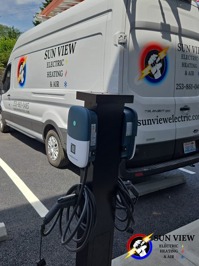 An EV charger mounted on a post beside the Sun View service van