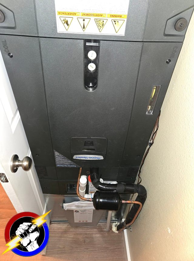 The internal components of a furnace and air handler with the panel off