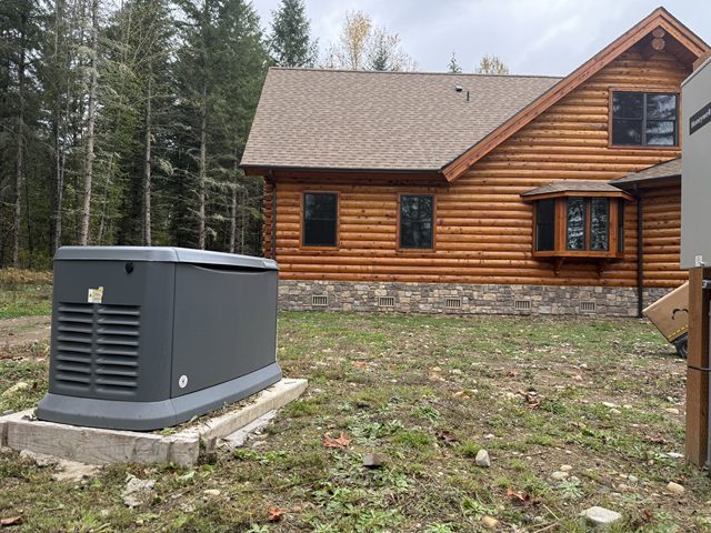 An automatic standby generator installed outside a log home