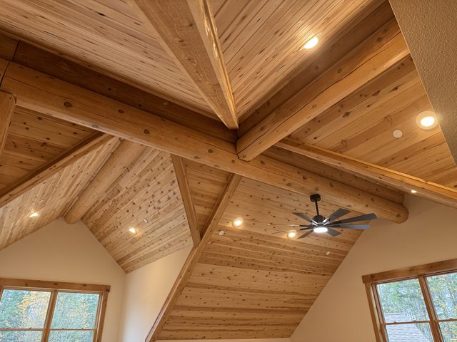 Recessed lighting fitted into a vaulted cedar ceiling